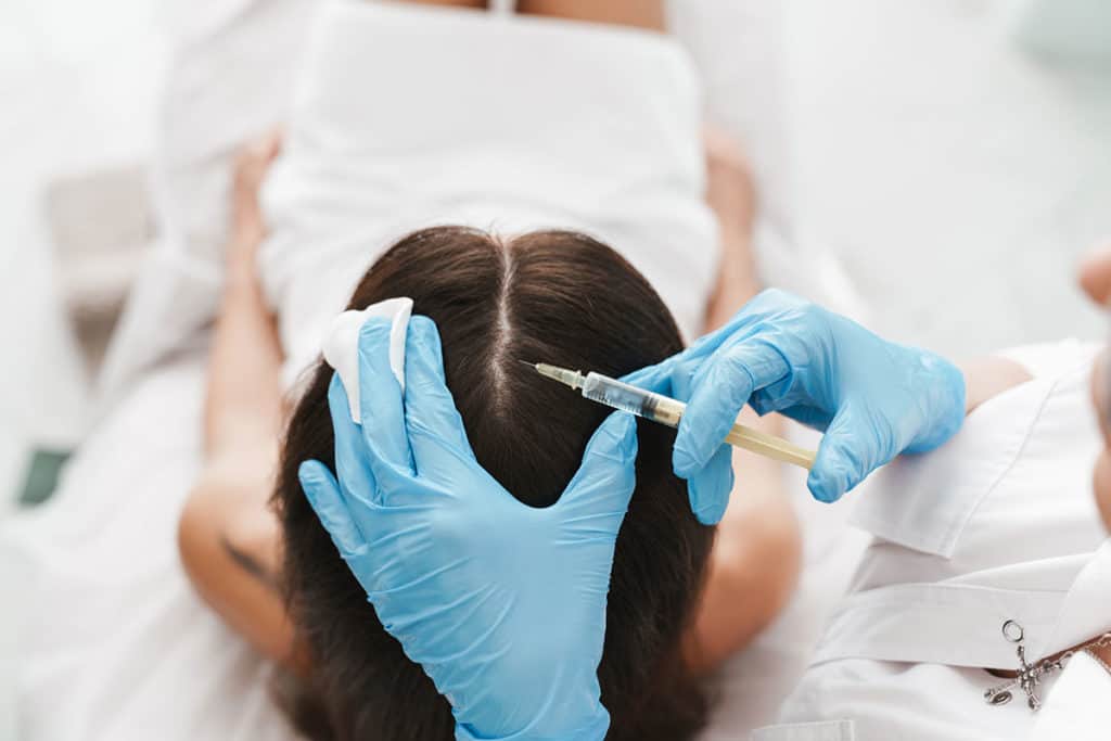 Woman receiving scalp injection